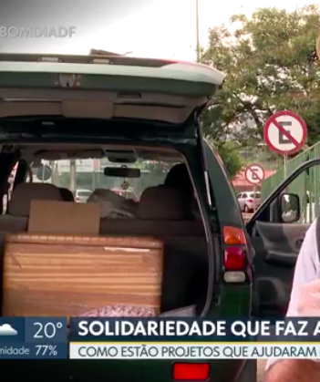 foto reportagem Adenilson Cruz entregando marmita